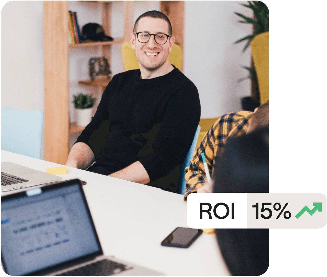 Man in glasses works with the Later influencer marketing services team to create a campaign with an ROI of 15 percent